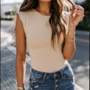 Sleeveless nude bodysuit, medium.